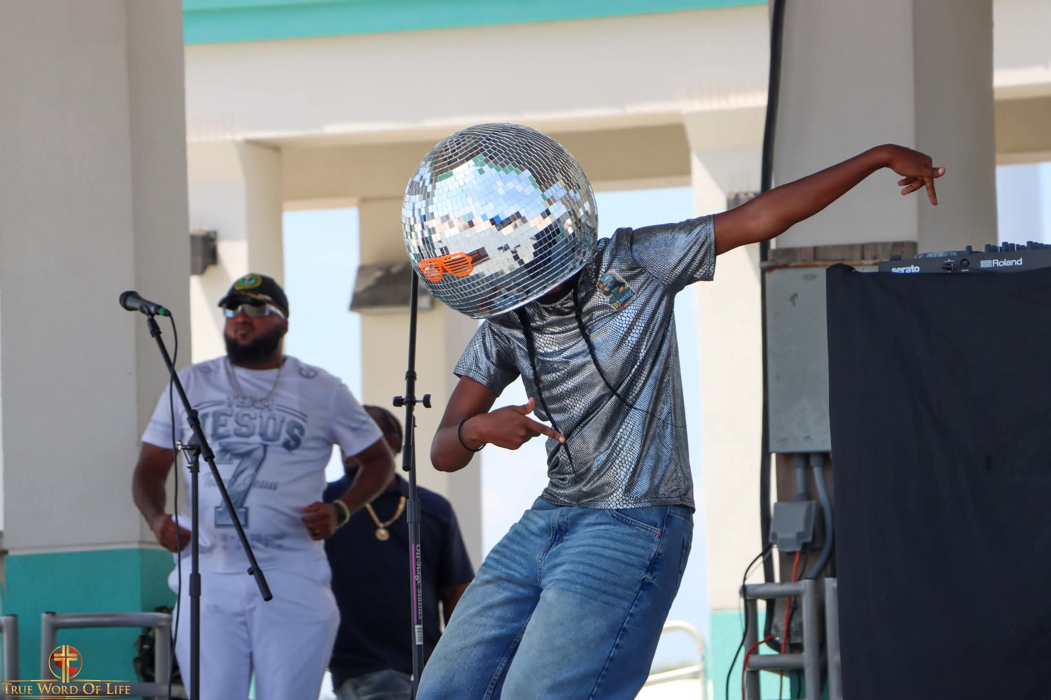 DJ Zmarie leaning into a dance move on stage